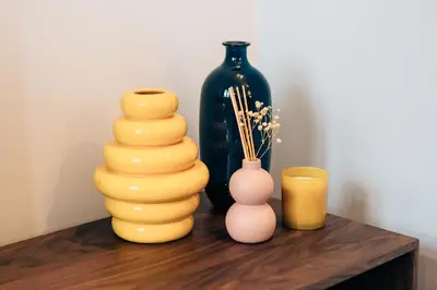 a group of vases sitting on a wooden table at ORM Padrão Apartment in Porto