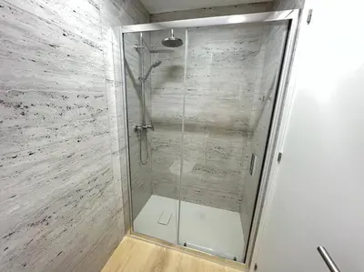 a shower with a glass door in a bathroom at HEART OF THE CITY 10 ! in Porto