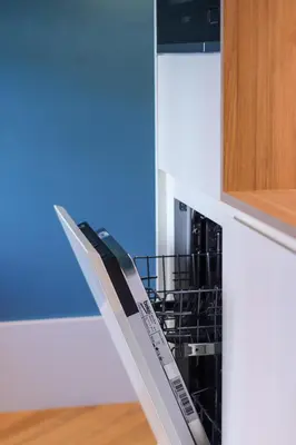 a dish drying rack in a kitchen next to a cabinet at HM - Infante Riverside Apartment B in Porto
