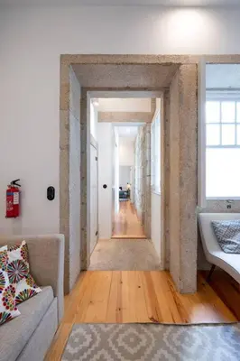 a hallway leading to a living room with a couch at VIVA Aliados Downtown in Porto