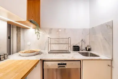 a kitchen with a sink and a counter top at VIVA Jolicoeur Porto in Porto