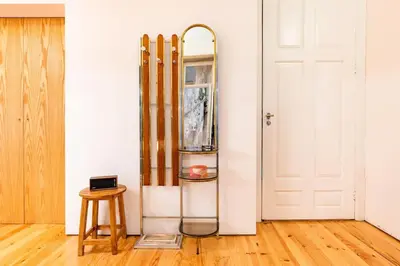 a room with skis and a glass shelf next to a door at VIVA Jolicoeur Porto in Porto