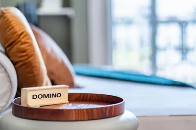 a wooden box with the word dominating sitting on a table at VIVA Mosaics Studio in Porto