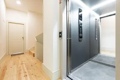 a hallway with a large black elevator in a building at VIVA Liberty 310 in Porto