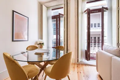 a dining room with a glass table and chairs at VIVA Liberty 310 in Porto