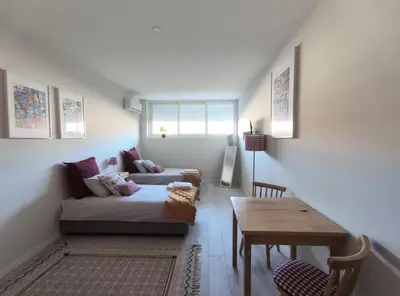 a living room with a couch and a table at Leote House - Studio 1 in Porto