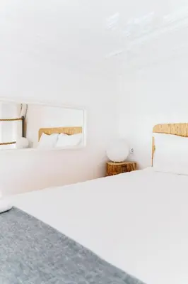 two beds in a room with white walls at The Loft 333 in Porto