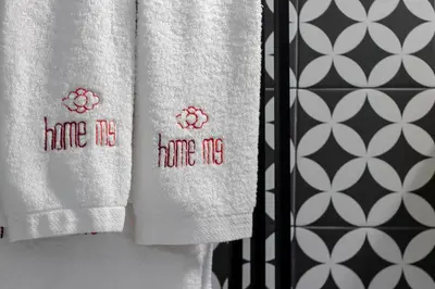 a pair of towels with the words have me have me at HM - Infante Riverside Apartment C in Porto