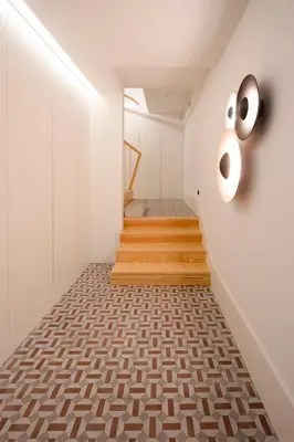 a staircase in a house with white walls and wooden floors at HM - Infante Riverside Apartment C in Porto