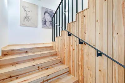 a wooden staircase in a home with wood paneling at Fontainhas Royal in Porto