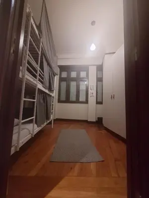 an empty room with bunk beds and a hallway at Easy Host Porto in Porto