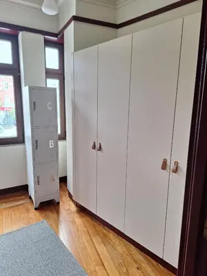 a room with white cabinets and a window at Easy Host Porto in Porto