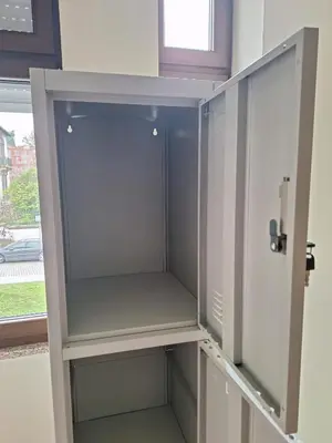 an empty cabinet in a room with a window at Easy Host Porto in Porto