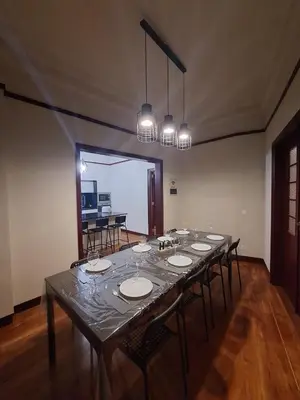 a large dining room with a long table with chairs at Easy Host Porto in Porto