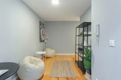 a living room with two bean bags and a shelf at GuestReady - Miragaia Blue in Porto