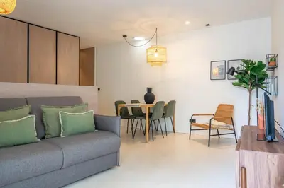 a living room with a couch and a table at The Priest's Home by LovelyStay in Porto