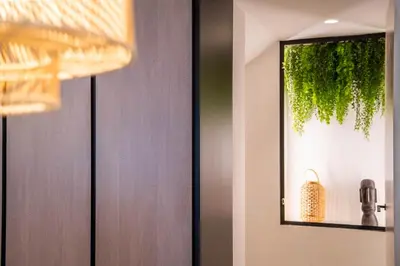 a door with a mirror and a plant on it at The Priest's Home by LovelyStay in Porto