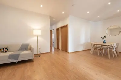 a living room with a couch and a table at GuestReady - Warm and Inviting flat with balcony in Porto