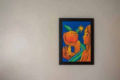 a painting of a woman holding an orange on a wall at Gardeny Porto in Porto