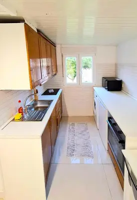 a kitchen with a washing machine and a washer at Bela Houses - Porto Center Garden - 3 in Porto