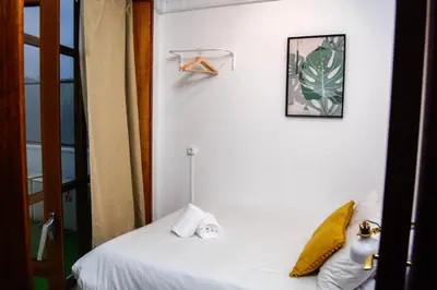 a bedroom with a bed and a picture on the wall at Travel & Live Marques Apartments in Porto
