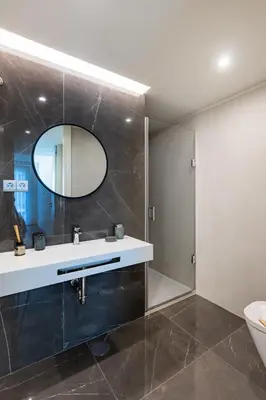 a living room with a couch and a tv at Renovato Prestige in Porto