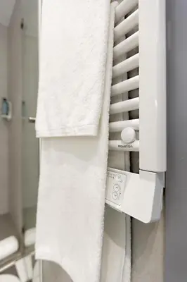 a refrigerator filled with white towels in a room at Almada 505 - Premium Flat in Porto