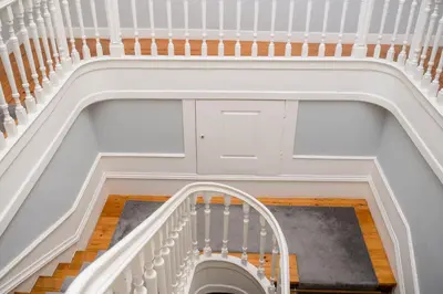 an overhead view of a stairway with a white stair case at Decanting Porto House in Porto