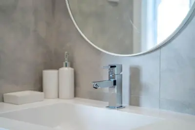 a bathroom sink with a faucet and a mirror at Gaia Retreat by LovelyStay in Vila Nova de Gaia