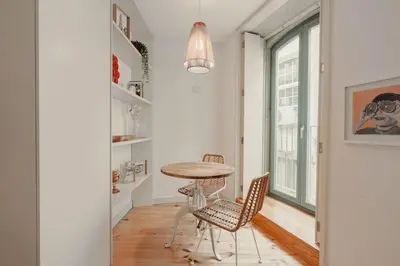 a dining room with a table and two chairs at Cristelo 1 Bed next to River in Porto
