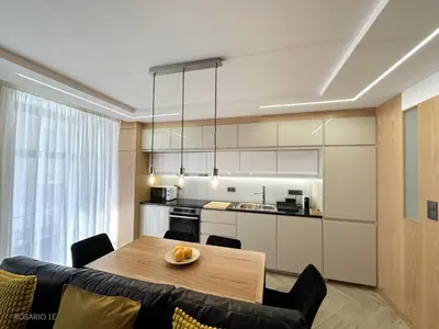 a kitchen and dining room with a table and chairs at ROSARIO 1E by rosario inn porto in Porto