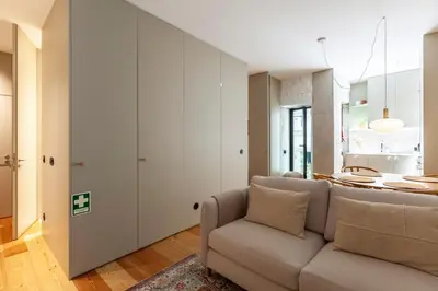 a living room with a couch and a table at Perfect retreat in the center of Porto in Porto