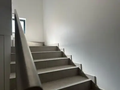 a staircase in a house with a hand rail at Marinho's Oporto Apartments II in Porto