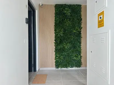 a hallway with a green wall at Marinho's Oporto Apartments II in Porto