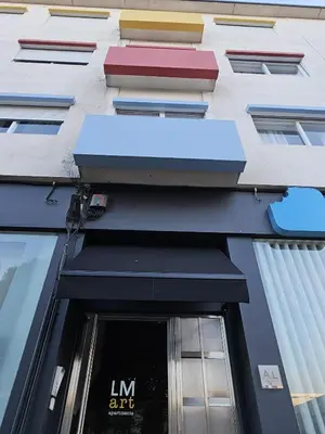 a bathroom with a sink and a mirror at LM art apartments in Porto