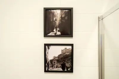 two framed photographs hanging on a wall in a museum at Alegria Colour Apartments in Porto