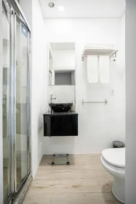 a bathroom with a sink and a toilet at Alegria Colour Apartments in Porto