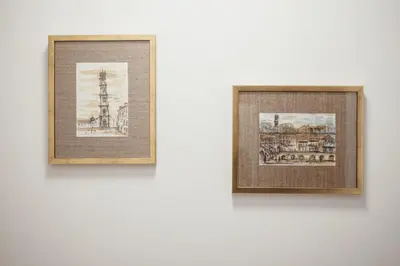 two framed photographs hanging on a white wall at City Center Grand Apartment With Seaview Terrace by Vacationy in Porto