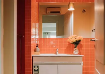 a bathroom with a sink and a mirror at D João IV Stay in Porto