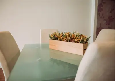 a glass table with a wooden box on top of it at D João IV Stay in Porto