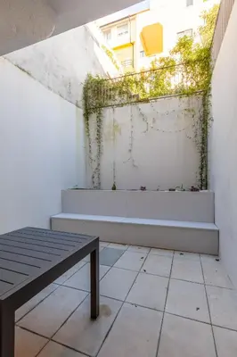 a balcony with stairs and a bench in a building at Sta. Catarina 618 Suite in Porto