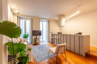 an apartment with a living room and a kitchen at Sta. Catarina 618 Suite in Porto