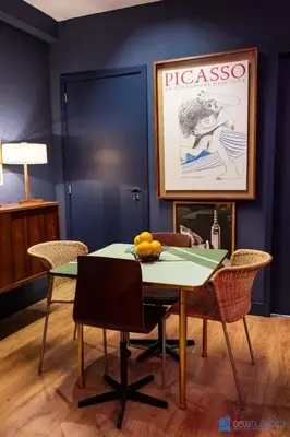 a dining room with a table with a bowl of fruit on it at Y Trendy Arthouse Boavista in Porto