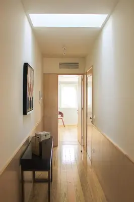 a hallway with a room with a table and a ceiling at Oporto Trendy Apartments in Porto