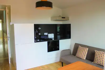 a living room with a couch and a tv at Oporto Trendy Apartments in Porto