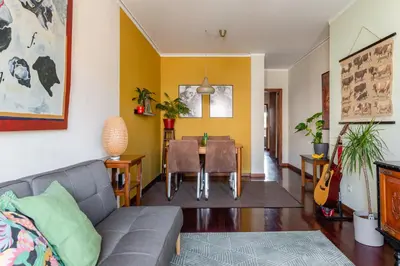 a living room with a couch and a table at Lázaro 2 Bedroom Apartment in Porto