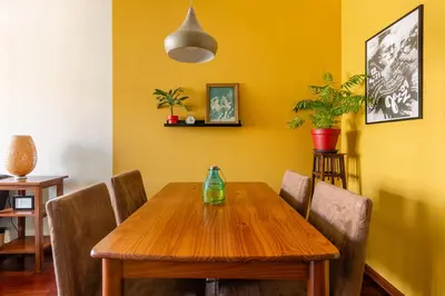 a dining room with a wooden table and chairs at Lázaro 2 Bedroom Apartment in Porto