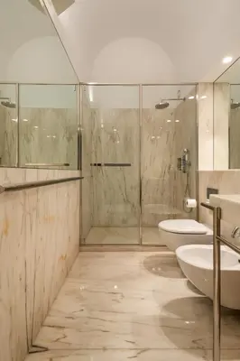 a bathroom with two sinks and a shower at Clerigos 82 luxury Housing in Porto