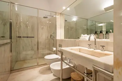a bathroom with a sink and a toilet and a shower at Clerigos 82 luxury Housing in Porto