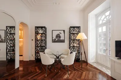 a dining room with a table and chairs at Clerigos 82 luxury Housing in Porto